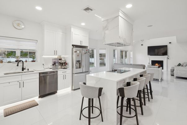 Fireplace, Interior, Kitchen, Living room, Marble Walls, Recessed Lighting, Stainless Steel Appliances