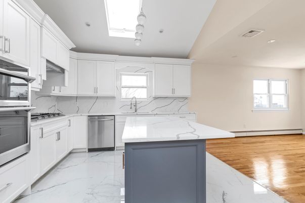 Interior, Kitchen, Marble, Marble Walls, Recessed Lighting, Stainless Steel Appliances, Wood Texture Flooring