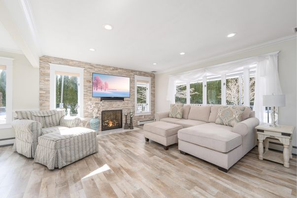 Fireplace, Interior, Living room, Recessed Lighting, Stone Walls, Wood Texture Flooring