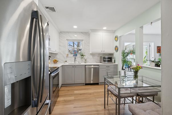 Dining room, Interior, Kitchen, Marble Walls, Recessed Lighting, Stainless Steel Appliances, Wood Texture Flooring
