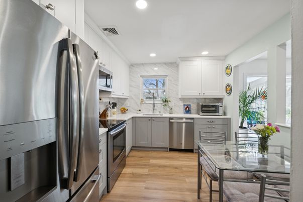 Dining room, Interior, Kitchen, Recessed Lighting, Stainless Steel Appliances, Wood Texture Flooring