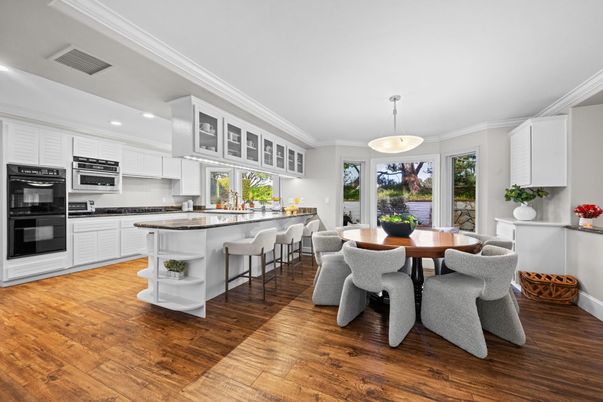 Dining room, Interior, Kitchen, Pendant Lights, Recessed Lighting, Stainless Steel Appliances, Wood Texture Flooring