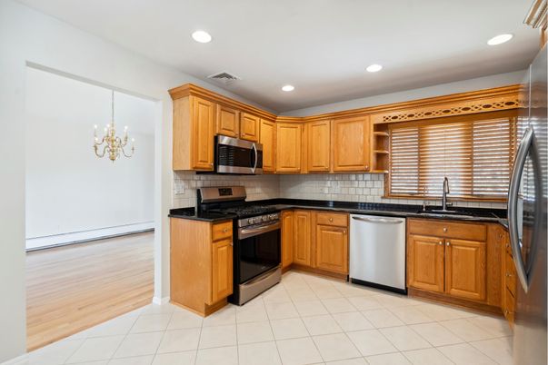 Chandelier, Interior, Kitchen, Recessed Lighting, Stainless Steel Appliances, Wood Texture Flooring