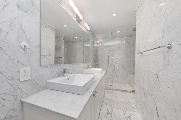 Bathroom, Dual Sink Vanities, Glass Shower, Interior, Marble, Marble Walls, Recessed Lighting