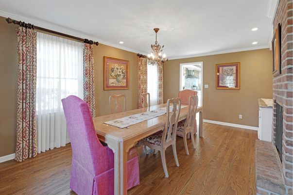 Chandelier, Dining room, Fireplace, Interior, Recessed Lighting, Stone Walls, Wood Texture Flooring