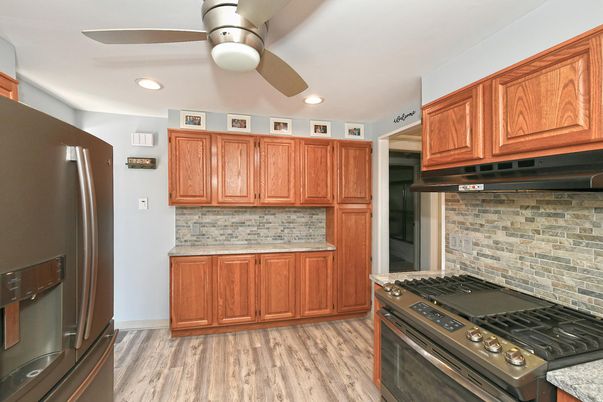 Interior, Kitchen, Recessed Lighting, Stainless Steel Appliances, Stone Walls, Wood Texture Flooring
