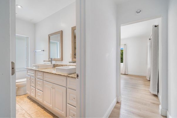 Bathroom, Dual Sink Vanities, Interior, Recessed Lighting, Wood Texture Flooring