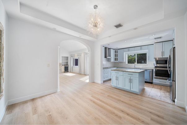 Chandelier, Interior, Kitchen, Recessed Lighting, Stainless Steel Appliances, Wood Texture Flooring