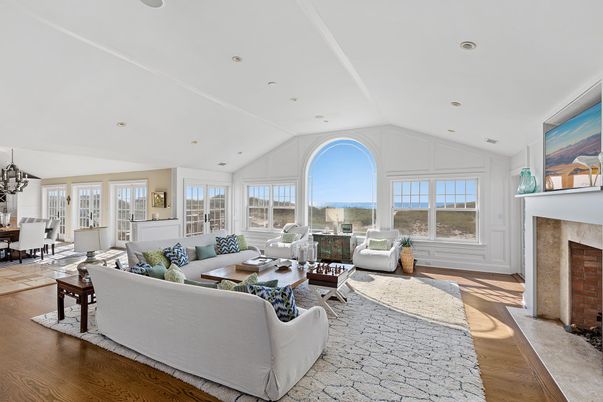 Chandelier, Dining room, Fireplace, Interior, Living room, Recessed Lighting, Water, Wood Texture Flooring