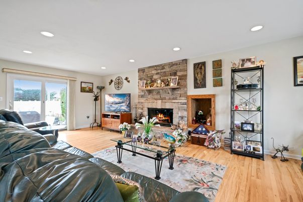 Fireplace, Interior, Living room, Recessed Lighting, Stone Walls, Wood Texture Flooring