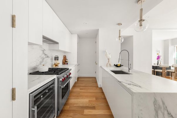 Interior, Kitchen, Marble Walls, Pendant Lights, Recessed Lighting, Stainless Steel Appliances, Wood Texture Flooring