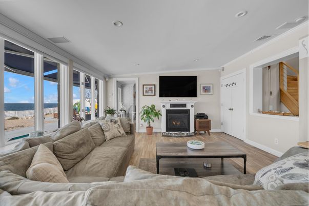 Fireplace, Interior, Living room, Recessed Lighting, Water, Wood Texture Flooring