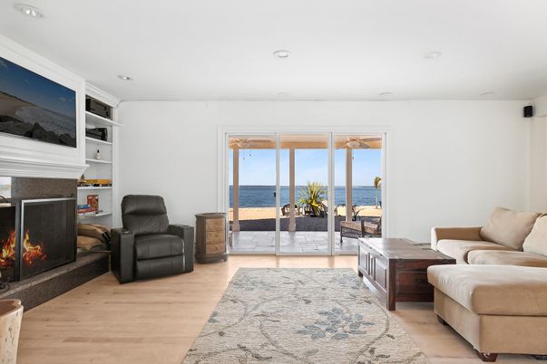 Fireplace, Interior, Living room, Recessed Lighting, Water, Wood Texture Flooring