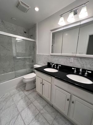 Bathroom, Dual Sink Vanities, Glass Shower, Interior, Marble Walls, Recessed Lighting