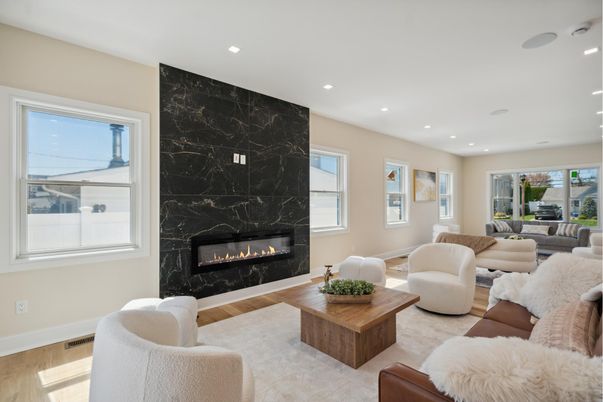 Fireplace, Interior, Living room, Marble Walls, Recessed Lighting, Wood Texture Flooring