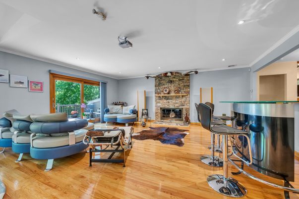 Fireplace, Interior, Living room, Piano, Recessed Lighting, Stone Walls, Wood Texture Flooring