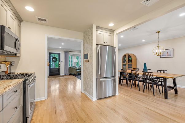 Chandelier, Dining room, Interior, Kitchen, Pendant Lights, Recessed Lighting, Stainless Steel Appliances, Wood Texture Flooring
