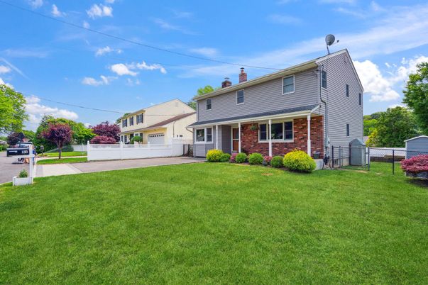 Attached, Backyard, Exterior, Facade, Brick Facade, Cape Cod