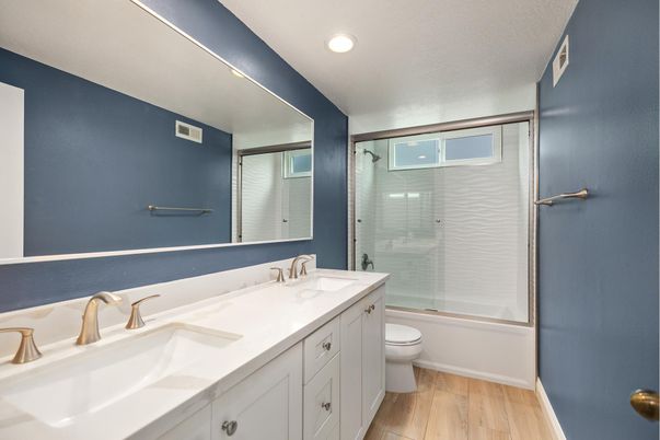Bathroom, Dual Sink Vanities, Glass Shower, Interior, Recessed Lighting, Wood Texture Flooring