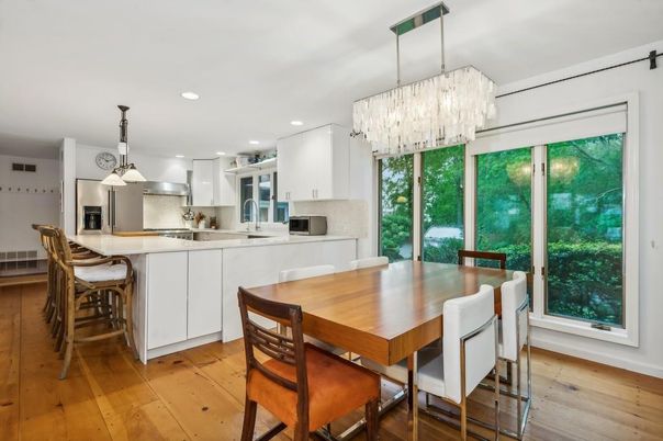Chandelier, Dining room, Interior, Kitchen, Pendant Lights, Recessed Lighting, Stainless Steel Appliances, Wood Texture Flooring