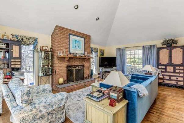 Fireplace, Interior, Living room, Recessed Lighting, Stone Walls, Wood Texture Flooring
