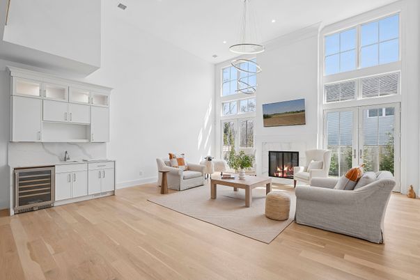 Fireplace, Interior, Living room, Marble Walls, Pendant Lights, Recessed Lighting, Wood Texture Flooring