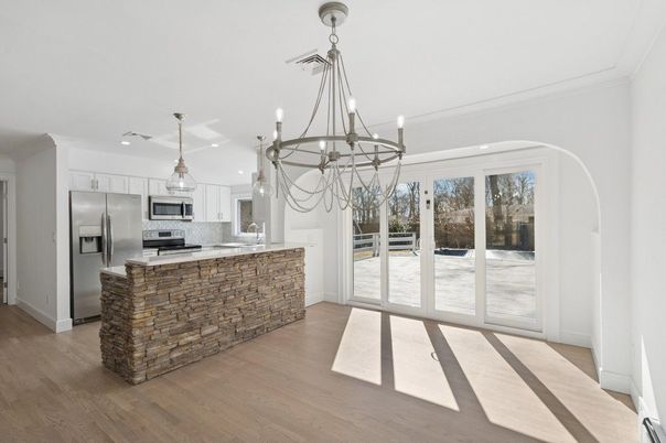 Chandelier, Interior, Kitchen, Pendant Lights, Recessed Lighting, Stainless Steel Appliances, Wood Texture Flooring