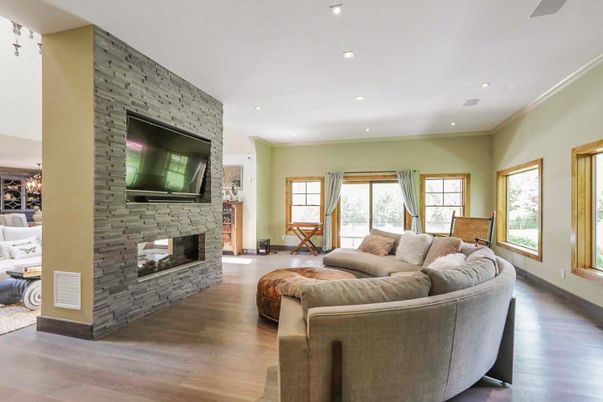 Fireplace, Interior, Living room, Recessed Lighting, Stone Walls, Wood Texture Flooring