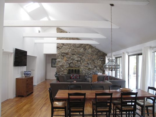 Dining room, Fireplace, Interior, Living room, Pendant Lights, Stone Walls, Wood Texture Flooring