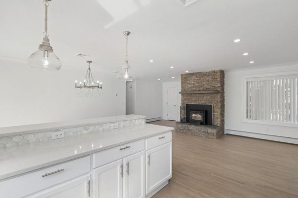 Empty room, Fireplace, Interior, Pendant Lights, Recessed Lighting, Wood Texture Flooring