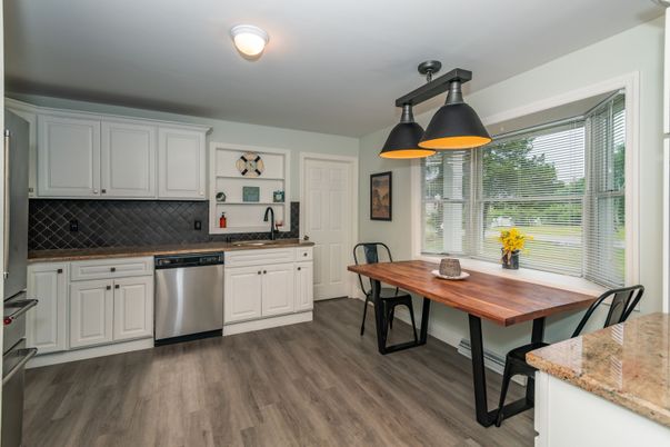 Dining room, Interior, Kitchen, Pendant Lights, Stainless Steel Appliances, Wood Texture Flooring