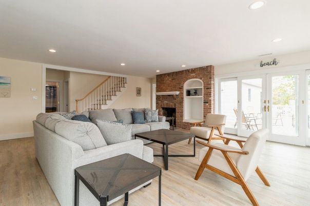 Fireplace, Interior, Living room, Recessed Lighting, Stone Walls, Wood Texture Flooring