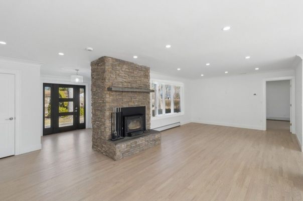 Empty room, Fireplace, Interior, Pendant Lights, Recessed Lighting, Stone Walls, Wood Texture Flooring