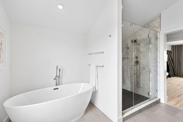 Bathroom, Free Standing Baths, Glass Shower, Interior, Marble Walls, Recessed Lighting, Wood Texture Flooring