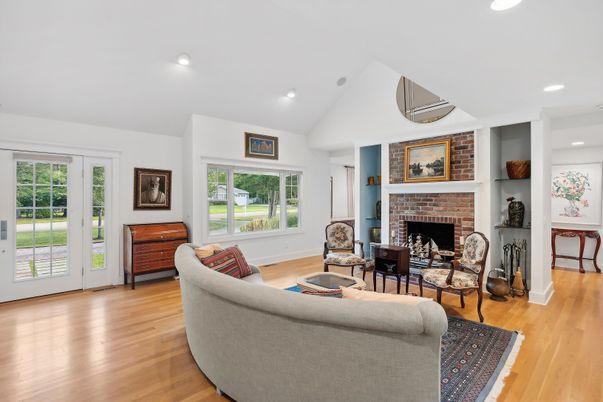 Fireplace, Interior, Living room, Recessed Lighting, Stone Walls, Wood Texture Flooring