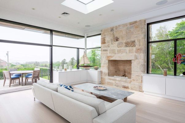 Dining room, Fireplace, Interior, Living room, Recessed Lighting, Stone Walls, Wood Texture Flooring