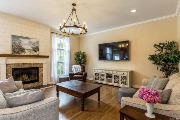 Chandelier, Fireplace, Interior, Living room, Recessed Lighting, Wood Texture Flooring