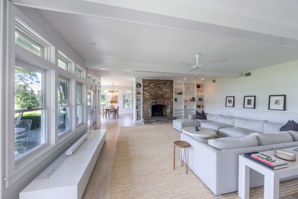 Dining room, Fireplace, Interior, Living room, Recessed Lighting, Stone Walls, Wood Texture Flooring