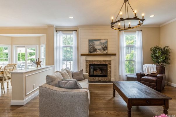 Chandelier, Dining room, Fireplace, Interior, Living room, Recessed Lighting, Wood Texture Flooring