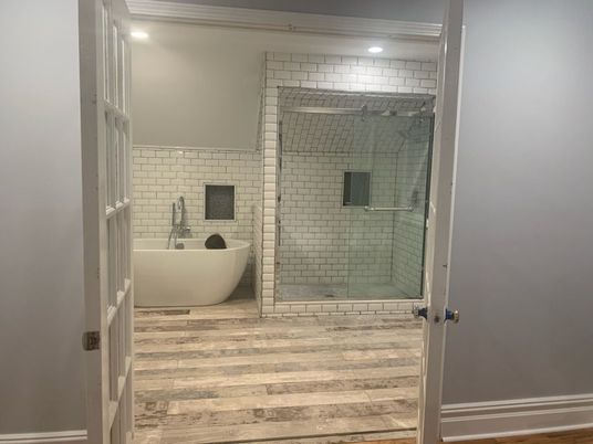 Bathroom, Free Standing Baths, Glass Shower, Interior, Recessed Lighting, Wood Texture Flooring