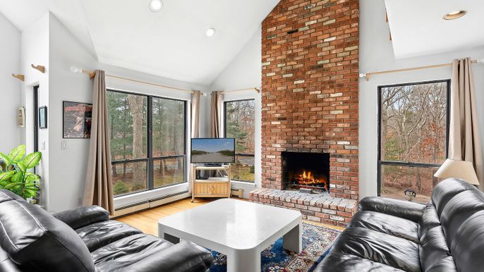 Fireplace, Interior, Living room, Recessed Lighting, Stone Walls, Wood Texture Flooring