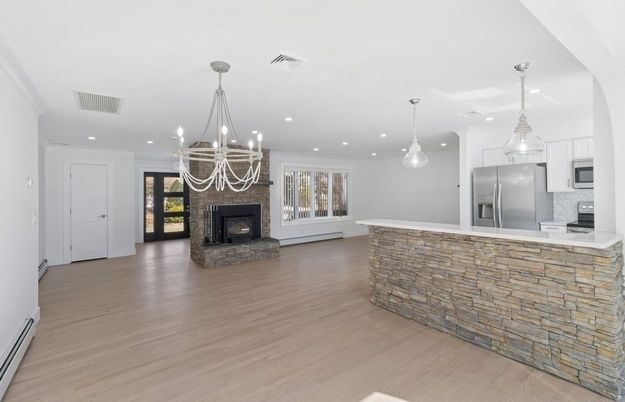 Chandelier, Fireplace, Interior, Kitchen, Pendant Lights, Recessed Lighting, Stainless Steel Appliances, Wood Texture Flooring