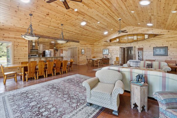 Dining room, Interior, Kitchen, Living room, Pendant Lights, Recessed Lighting, Stainless Steel Appliances, Stone Walls, Wooden Beams, Wooden Ceilings, Wood Texture Flooring, Wooden Walls