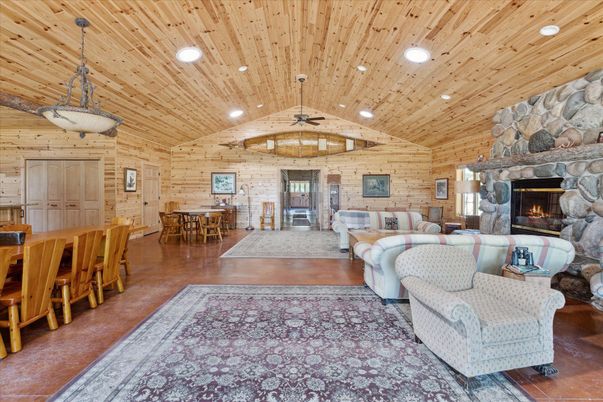Dining room, Fireplace, Interior, Living room, Pendant Lights, Recessed Lighting, Stone Walls, Wooden Ceilings, Wood Texture Flooring, Wooden Walls