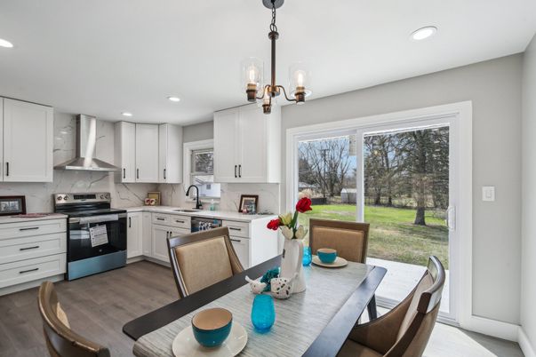 Dining room, Interior, Kitchen, Pendant Lights, Recessed Lighting, Stainless Steel Appliances, Wood Texture Flooring