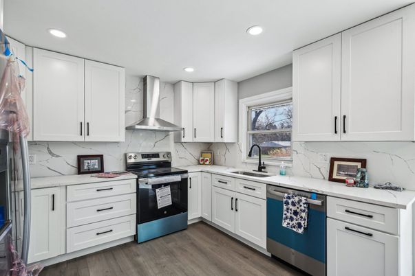 Interior, Kitchen, Marble Walls, Recessed Lighting, Stainless Steel Appliances, Wood Texture Flooring