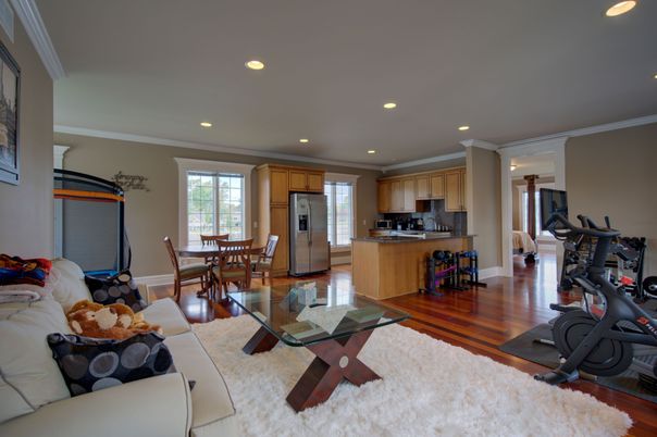 Dining room, Fitness Equipment, Interior, Kitchen, Recessed Lighting, Stainless Steel Appliances, Wood Texture Flooring