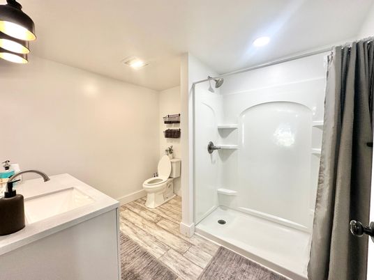 Bathroom, Glass Shower, Interior, Recessed Lighting, Wood Texture Flooring