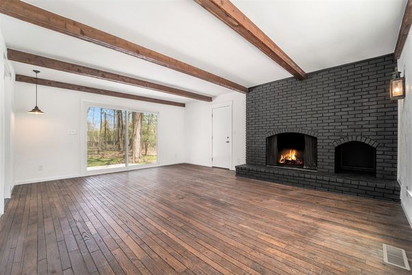 Empty room, Fireplace, Interior, Pendant Lights, Stone Walls, Wooden Beams, Wood Texture Flooring