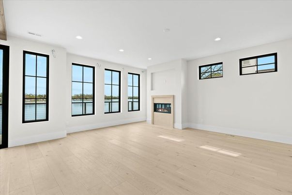Empty room, Fireplace, Interior, Recessed Lighting, Water, Wood Texture Flooring